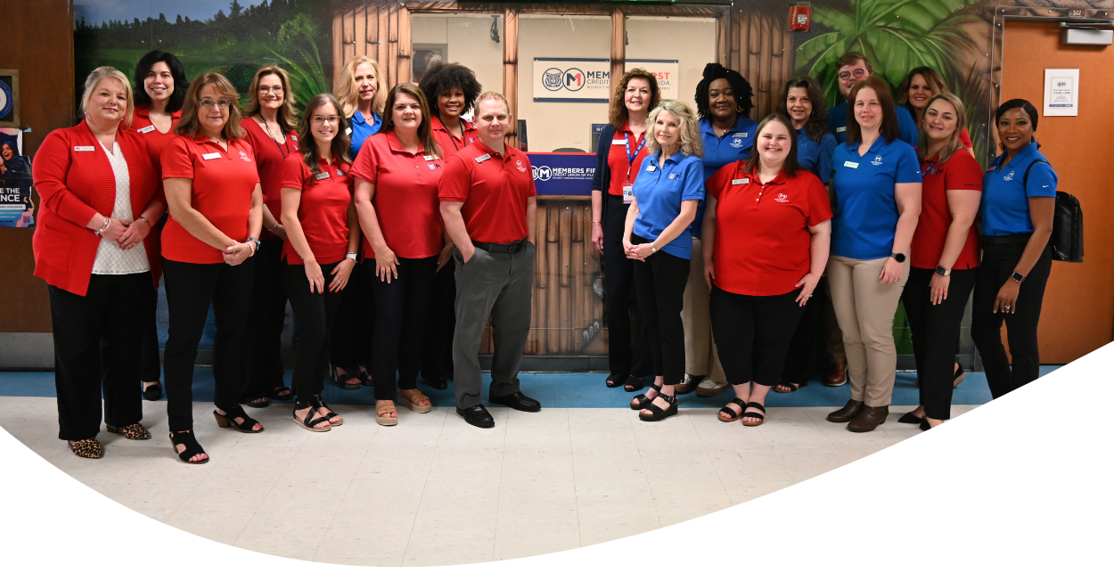 Members First team members in front of student-run Members First Credit Union of Florida branch at BTWHS