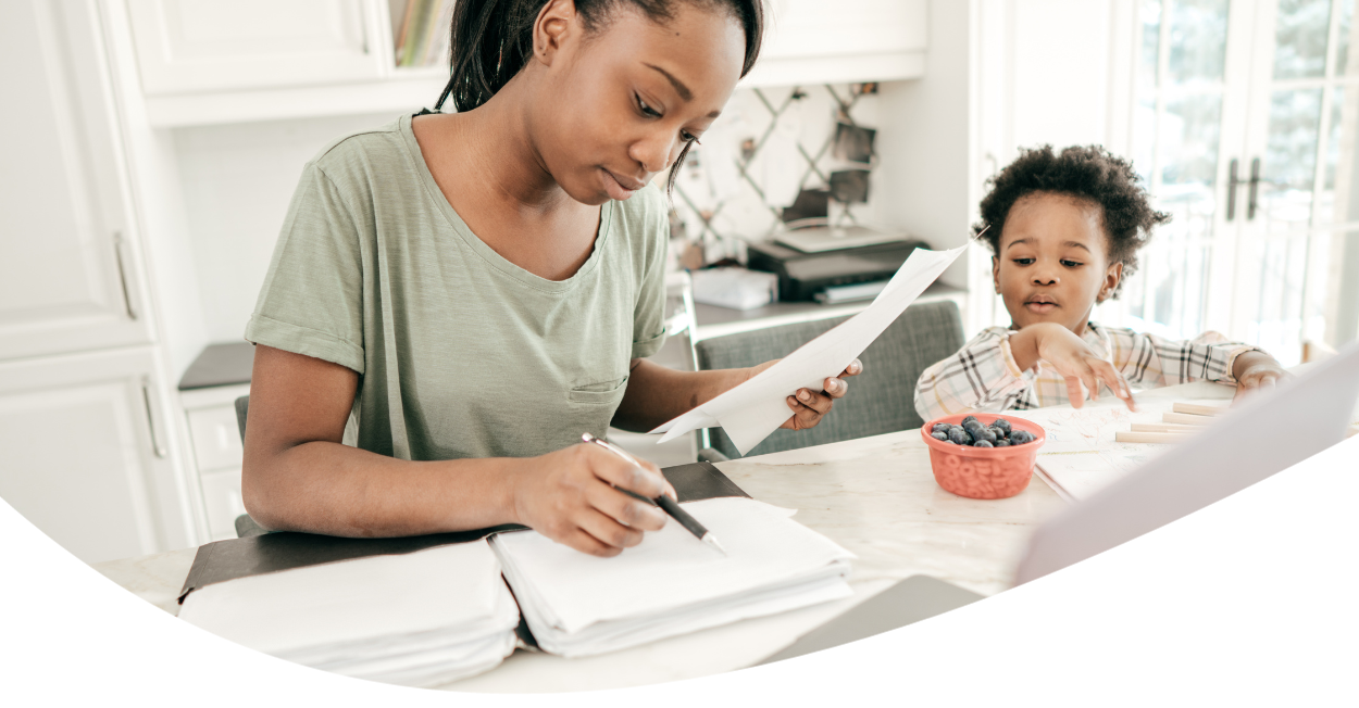 Mother doing paperwork on counter