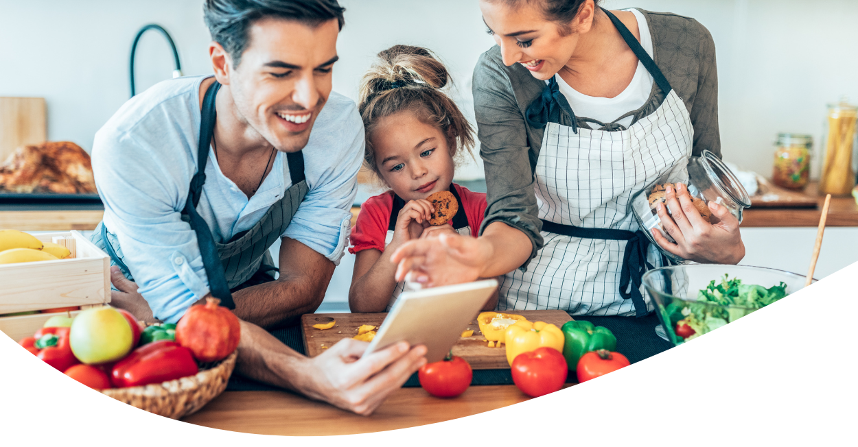 family cooking in kitchen