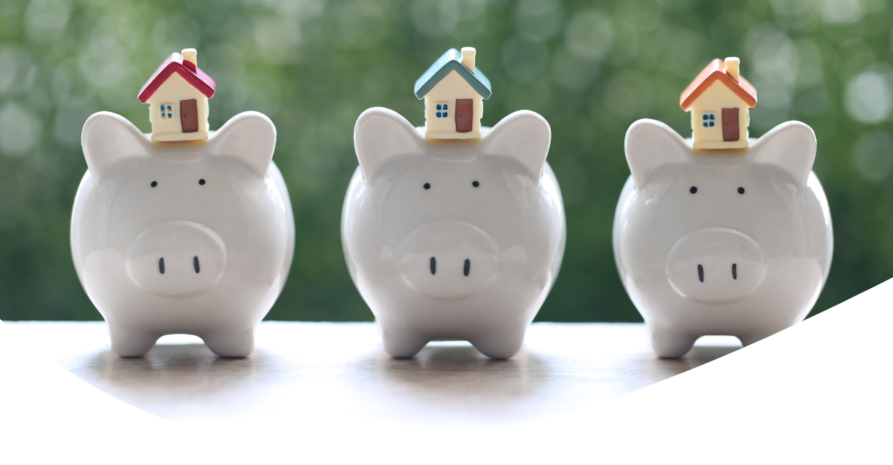 homes sitting on top of piggy banks