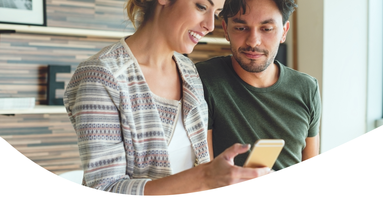 couple looking at smartphone