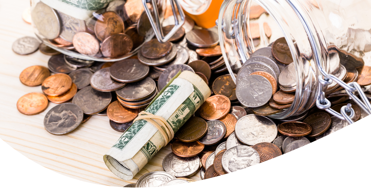 Savings jar with coins and cash