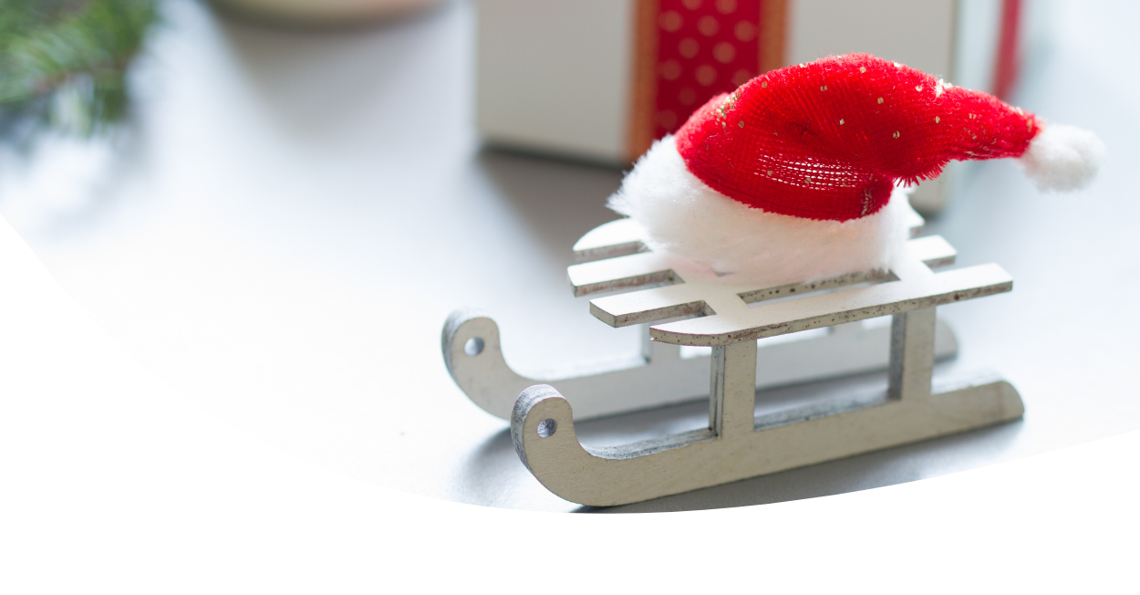 wooden sleigh with Santa hat