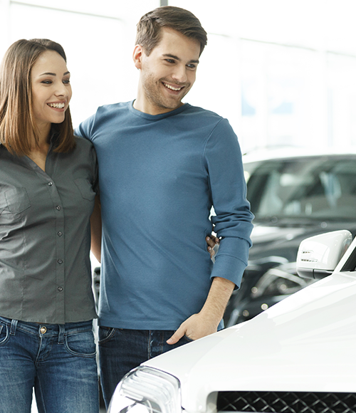 couple looking at car