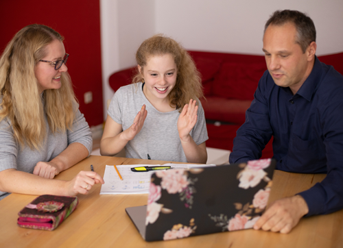 mother and father teaching teen