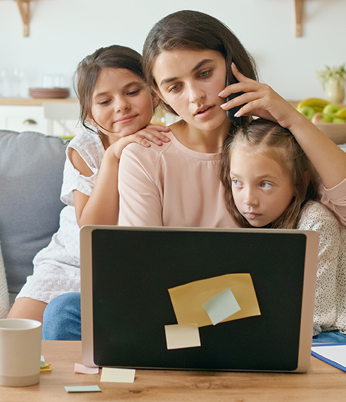 busy mother on computer and phone