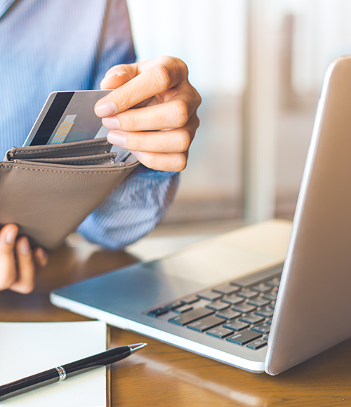 person taking credit card out of wallet