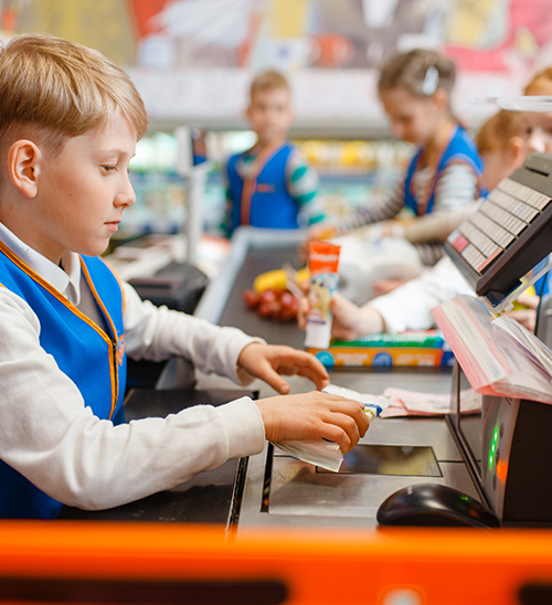 children pretending to work at the store