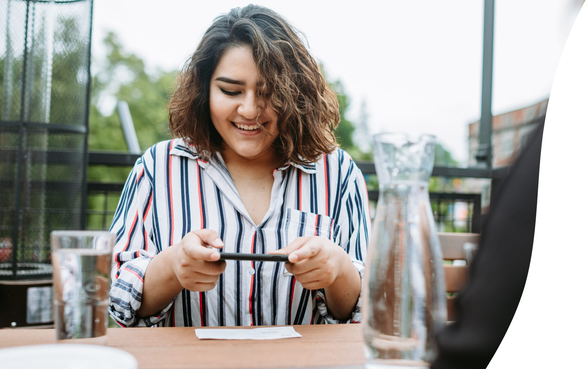 woman taking a photo of check